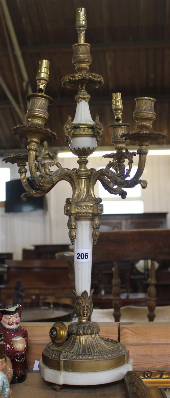 A pair of Louis XVI style white marble and ormolu mounted five branch candelabra, 30in.